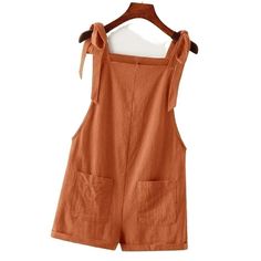 Adorable Tie Knot Strap Overall Shorts Pocket Jumpsuit In Rust Brown Fabric: 100% Cotton Design: Tie Knot Strap/ Double Pocket Front/ Roll Up Hem Small: Size 4 Length:31.1 Inch, Bust:35 Inch, Waist Size:35.8 Inch, Hip Size:4 0.9 Inch, Thigh:27.2 Inch, Straps Length:25.6 Inch Medium: Size 6 Length:31.6 Inch, Bust:36.6 Inch, Waist Size:37.4 Inch, Hip Siz E:42.5 Inch, Thigh:28 Inch, Straps Length:25.8 Inch Large: Size 8/10 Length:32.3 Inch, Bust:39 Inch, Waist Size:39.8 Inch, Hip Size:4 4.9 Inch, T Overalls With Pockets For Day Out, Solid Overalls With Pockets For Day Out, Cotton Jumpsuits And Rompers With Tie Straps For Vacation, Sleeveless Shortalls For Summer Day Out, Cotton Jumpsuit With Tie Straps For Vacation, Summer Overalls With Pockets For A Day Out, Summer Overalls With Pockets, Fitted Shortalls For Summer Day Out, Casual Cotton Overalls With Tie Straps