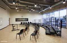 an empty room with many chairs and tables