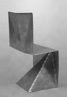 an abstract sculpture made out of metal sheets