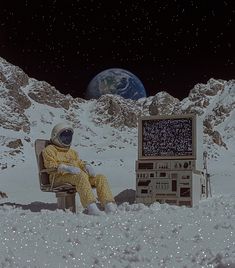 an astronaut sitting on a bench in the snow next to a computer monitor and television