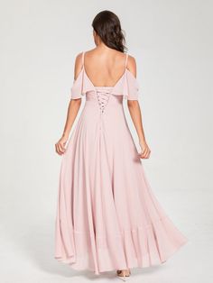 the back of a woman wearing a pink dress