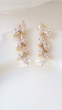 "Dainty and feminine, but with a lot of sparkle! This amazing pair of earrings feature shimmering 1 1/2\" long clear leaf marquise drops set in either a gold color, rose gold color or silver color finish. Select your finish at checkout. The earwire is a post/stud. Lightweight for all day comfort! Total earring length including the earwire approx: 1 1/2\" Width: 1/2\" MORE BRIDAL EARRINGS IN MY SHOP https://www.etsy.com/shop/Uniquebeadables?section_id=11352280&ref=shopsection_leftnav_5 BRIDAL Gold Marquise Diamond Earrings For Wedding, Gold Marquise Earrings For Party, Vine Bracelet, Vine Earrings, Rose Gold Bridal Earrings, Gold Bridal Earrings, Rose Gold Bridal, Bracelet Earring Set, Elegant Bracelet