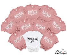 a bunch of pink onesuits with names on them