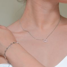 This elegant heart pendant necklace is crafted from high-quality stainless steel and features a cubic zirconia insert. Hypoallergenic and waterproof, it’s perfect for daily wear without tarnishing, offering durability and style. Pendant Size: 10 mm x 10 mm (0.39 x 0.39 inches) Necklace Length: 450 mm + 50 mm extender (17.72 + 1.97 inches) White Gold Stainless Steel Heart Pendant Necklace, Silver Double Heart Stainless Steel Necklace, Silver Stainless Steel Double Heart Necklace, Silver Stainless Steel Heart Necklace, Minimalist Stainless Steel Heart Charm Jewelry, Hypoallergenic Heart-shaped Stainless Steel Jewelry, Stainless Steel Clavicle Chain Heart Necklace, Elegant Silver Heart Necklace In Stainless Steel, Elegant Silver Stainless Steel Heart Necklace