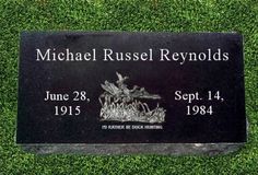 a plaque on the grass that reads michael russell reynoldss