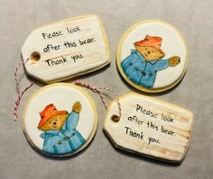 four hand painted wooden tags with sayings on them, one says please look after this bear and the other says thank you