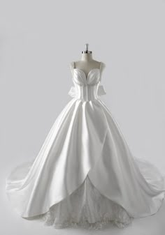 a white wedding dress on a mannequin