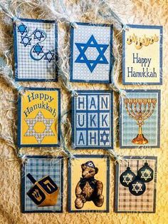 hanukkah cards are hung on a wall with judaira and jewish symbols