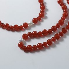 Embark on a journey of auspiciousness with our stunning Natural Red Agate Necklace and Bracelet set – where good fortune meets timeless beauty! 🔴✨Let the red waves of luck and prosperity adorn you in the upcoming New Year! 🧧 Key Features: Material: Authentic red agate beads paired with a lustrous natural pearl for a touch of elegance. Symbolism: Embrace the vibrant energy of the New Year with the auspicious hues of red, symbolizing luck and prosperity. Unique Touch: Each set features natural a Red Waves, Red Agate Necklace, Agate Stone Necklace, Strong Emotions, Vibrant Energy, Onyx Bracelet, Gemstone Beaded Bracelets, Red Agate, Agate Necklace