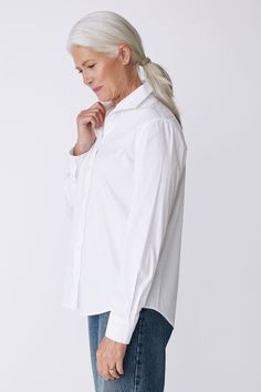 With a tailored look yet an ease of fit, our Box Pleat Ginna shirt is made for women on the move. A unique single piece collar construction can be worn up or softly folded befitting your mood. Back box pleat, center front exposed button closure, classic cuff length, sleeve placket detail, and signature loop detail. - 83% Cotton, 14% Polyamide, 3% Elastin - Made in NYC - Dry clean or machine wash - Our model is 5'9.5" wearing size 4 - Chest Width 40", Hip Width 45", Length 28" Orders are processed within three business days (not including weekends or holidays). All pre-orders are charged at the time of purchase and shipped on the date indicated on each style. All returns are subject to a per order restocking fee. Please visit the RETURNS/EXCHANGES page to review our policies regarding retur Classic Fitted Everyday Shirt, Modern Fitted Blouse With Shirttail Hem, Fitted Blouse With Fold-down Collar For Daywear, Fitted Blouse With Fold Down Collar For Daywear, Chic Everyday Shirt With Collared Neckline, Modern Business Casual Blouse With Fold-down Collar, Modern Blouse With Fold Down Collar For Business Casual, Modern Formal Top With Shirttail Hem, Modern Formal Tops With Shirttail Hem