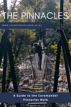 a woman walking across a suspension bridge over a river with the words, the pinnacles