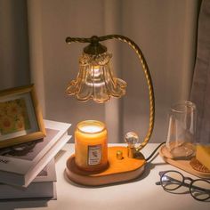 a table with a candle, glasses and other items on it