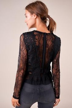 The Temptress is a sheer lace top covered in a floral design. The top features a high neckline, long fitted sleeves, and a darted bodice with a cropped, pleated hem. This ultra-sultry number is perfect for showing off your midriff in jeans and heels. Model is 5'9" and wearing size small. Pre-Order Now! Estimated Shipping Date October 25, 2019. Available in black. 100% polyester. Imported. Fitted Elegant Mesh Top With Sheer Bodice, Elegant Fitted Mesh Top With Sheer Bodice, Long Sleeve Lace Patchwork Top For Night Out, Sheer Fitted Mesh Top For Date Night, Fitted Lace Top With Lace Sleeves For Fall, Chic Fitted Mesh Top For Date Night, Fall Lace Mesh Top, Sheer Long Sleeve Mesh Top For Date Night, Lace Mesh Top With Lace Trim For Night Out