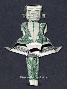 an origami doll made out of money