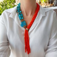 Turquoise and orange crystal layered necklace with long fringe pendant. Chunky statement beaded necklace for women. Large light blue and orange handmade necklace. Bohemian bright necklace in gold color are suitable for an casual look, evening look and for a holiday. These necklace will be a good Christmas, anniversary, wedding or birthday gift for women, mom, wife, girlfriend, sister or daughter. Women's necklace with stone. It emphasizes the beauty of your neck and adds charm to your look. FAST Elegant Orange Necklaces With Natural Stones, Elegant Orange Beaded Crystal Necklace, Turquoise Multi-strand Necklace For Party, Handmade Orange Long Necklace, Handmade Orange Necklace, Orange Faceted Beads Jewelry, Multi-strand Orange Necklaces For Gifts, Orange Double Strand Beaded Necklace As Gift, Orange Double Strand Beaded Necklace For Gift