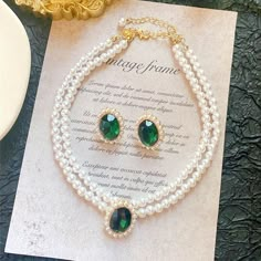 pearl-necklace-and-earring-set-multi-strand-pearl-necklace-emerald-stud-earrings-in-a-jewelry-set Bride Pearl Necklace, Pearl Necklace And Earring Set, Multi Strand Pearl Necklace, Emerald Stud Earrings, Necklace Emerald, Pearl Necklace Vintage, Emerald Earrings Studs, Bride Earrings, Pearl Jewelry Sets