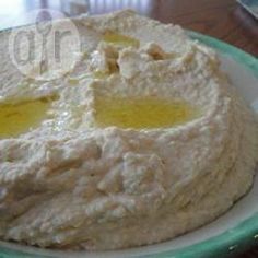 a close up of a cake on a plate with butter and oil in the middle