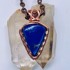 Handmade Boho Copper & Lapis Lazuli Wire Wrapped Pendant At our shop, we take pride in crafting each piece of jewelry with meticulous attention to detail. We select only the most exquisite gemstones for our pendants, and all our stones are hand-cut and polished in our on-site lapidary shop located in Coolidge, AZ. Every item is crafted from start to finish by us, Alan and Dawn, the passionate shop owners. You can find more beautiful pendants in our shop https://hippieblinghandmade.etsy.com We ho Handmade Artisan Necklace For Gifts, Blue Gemstone Copper Jewelry, Blue Gemstone Jewelry In Copper, Blue Copper Gemstone Jewelry, Handmade Blue Minimalist Necklace, Handmade Minimalist Blue Necklace, Handmade Artisan Crystal Necklaces With Copper, Handmade Artisan Copper Crystal Necklaces, Artisan Wire Wrapped Jewelry For Meditation