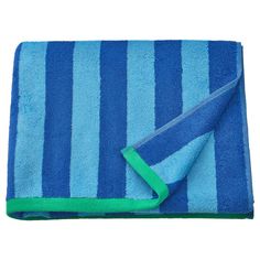 a blue and green striped towel folded on top of a white surface with a green strip