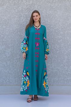 "A stunning embroidered Kaftan dress that is elegant, colorful, and unique! The dress is made of Egyptian cotton that has a soft feel to it so you will surely feel comfortable and royal in it. It also comes with a small invisible pocket on the right side of the Kaftan for added practicality.  You can wear this Kaftan practically anywhere and for any occasion. You can dress it up with a pair of heels and strut like an Egyptian queen in any gathering, resort, or party. Or you can dress it down wit Spring Maxi Dress With Resham Embroidery, Spring Bohemian Maxi Abaya, Green Floral Embroidered Maxi Dress, Spring Vacation Floor-length Abaya, Multicolor Floral Embroidered Maxi Dress, Traditional Embroidered Maxi Dress For Spring, Spring Maxi Length Abaya, Bohemian Maxi Length Abaya For Eid, Green Embroidered Floor-length Maxi Dress