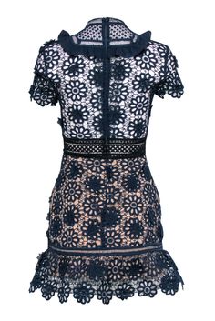 Ready to make a statement at your next cocktail party? Slip into this navy lace eyelet short sleeve dress from Self-Portrait, paired perfectly with black strappy heels. This dress is both elegant and fun, making you the center of attention at any event. Size 2 Shell 97% Polyester, 6% Polyamide Lining 97% Polyester, 3% Spandex Invisible zipper back Short sleeve Semi sheer details Black lace up tie detail Mock neck Ruffle trim Bust 34" Waist 27" Shoulder to hem 33" Sleeve length 7" Short Sleeve Mini Dress With Lace Trim For Evening, Elegant Navy Mini Dress With Short Sleeves, Elegant Navy Short-sleeved Mini Dress, Elegant Navy Short Sleeve Mini Dress, Chic Scalloped Lace Short Sleeve Mini Dress, Chic Short Sleeve Mini Dress With Scalloped Lace, Summer Lace Dress With Short Sleeves For Night Out, Lace Mini Dress With Short Sleeves For Night Out, Summer Short Sleeve Lace Dress For Night Out