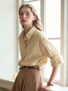 Cut from crisp cotton fabric, this relaxed fit shirt features casual open collars and buttoned front design. Wear yours alone, or layer with various items throughout the seasons.  - Intended for a loose fit- Comfortable dropped shoulders- Logo embroidery detail at cuff- Rounded hem design- Casual seam detail and chest pocket Yellow Workwear Tops With Pockets, Yellow Workwear Tops With Button Cuffs, Yellow Tops With Button Cuffs For Work, Spring Yellow Shirt With Pockets, Yellow Workwear Shirt With Pockets, Yellow Work Shirt With Pockets, Yellow Collared Shirt For Work, Collared Yellow Shirt For Work, Yellow Button-up Shirt For Work