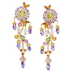 Set in 18 kt. yellow gold, are these stunning multi-color gem flower hanging earrings with round Scapolite centers surrounded by Pear shaped Amethysts. Cascading from the flowers are Briolettes of Amethyst. A diamond stem is then accented with pear shaped Citrine, Pink Tourmaline, Peridot and Pearls. Earrings Measure 3" long. Semiprecious total carat weight: 14.13cts. Amethyst 20.18 cts. Diamond 0.42cts. Pearl Hanging Earrings, Flower Drop Earrings, Citrine Earrings, Hanging Earrings, Antique Earrings, Amethyst Earrings, Gold Floral, Dream Jewelry, Pretty Jewellery