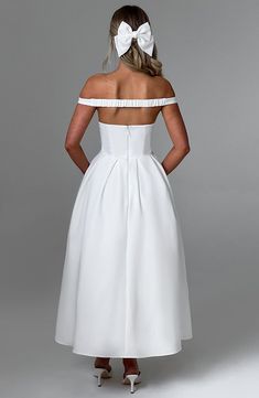 The epitome of elegance, Lanetta features a plunge bardot neckline with elasticated back strap bringing stylish flair. Falling to an effortlessly chic midi length, the design has a full, box pleated skirt and looks amazing paired with pointed heels and soft glam. 



Colour: Ivory.

Premium non-stretch crepe.

Fully lined.

Plunge bardot neckline.

Shaped underbust seam.

Full, box pleated skirt.

Elasticated back strap.

Invisible zipper fastening.

Midi length.

 Size: XS, S, M, L, XL, XXL Off-shoulder Pleated Gala Dress, Off-shoulder Pleated Dress For Gala, Pleated Off-shoulder Gala Dress, White Midi Dress With Pleated Bodice For Evening, White Midi Dress With Pleated Bodice For Cocktail, Elegant Off-shoulder Midi Dress For Wedding Guest, White Pleated Bodice Evening Dress For Cocktail, A-line Midi Dress With Ruched Bodice For Gala, White Evening Dress With Pleated Bodice For Cocktail