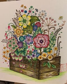 a drawing of flowers in a wooden box