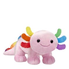 a pink stuffed animal with multicolored wings