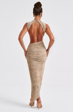 Crafted in our textured stretch fabric that hugs every curve, the Aphrodite midi features an asymmetric skirt with thigh high split. The high neck design is complete with a showstopping open back detail. Style yours with heeled mules and sleek waves. 



Colour: Beige.

Textured stretch fabric.



Open low back.

Asymmetric skirt.

Thigh high split.

Button closure at back neck.

High neck.

Midi length.

Model is an XS and is wearing an XS.

 Size: XS, S, M, L, XL, XXL Low Back Halter Dress, Maxi Vacation Dress, Assymetric Dress, Sleek Waves, Homecoming Dresses Corset, Sensual Dress, Style Long Dress, Midi Dress Wedding Guest, Norwegian Style