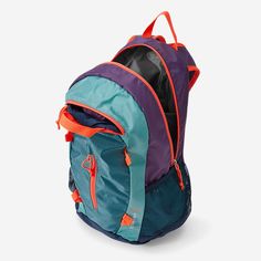 a blue and purple backpack sitting on top of a white floor