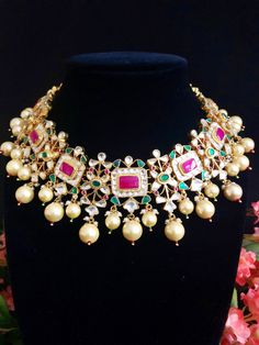 Sabyasachi Bridal Kundan Necklace/Ruby Kundan Necklace/Indian Bridal Necklace/Indian Wedding Necklace/Kundan Wedding Jewelry/Jadau Necklace Features 1-Handmade Gold Plated Indian Kundan Jewelry Necklace and Jhumka Earrings Set. 2-22 K Gold Plated Jewelry 3-Beautiful Wedding Necklace with Statement Earrings. 4-Traditional Kundan/Meenakari/Jadau Necklace Set 5-Handcrafted To Perfection 6-Unique boutique design 7- Perfect Bridal Necklace Set Dimensions: Necklace: Adjustable Fitting Earrings: Approx Luxury Kundan Meenakari Necklace With Ruby, Kundan Necklace With Zari Work For Reception, Kundan Necklaces With Zari Work For Reception, Heavy Kundan Necklace For Diwali Reception, Multicolor Kundan Necklaces For Reception, Multicolor Bollywood Necklace For Reception, Bollywood Bridal Necklace For Festivals And Receptions, Bollywood Bridal Necklace For Receptions And Festivals, Bollywood Style Multicolor Necklace For Reception