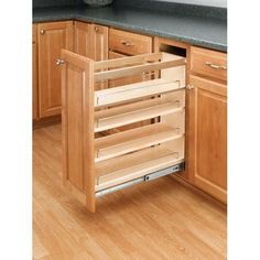 an open drawer in the middle of a kitchen