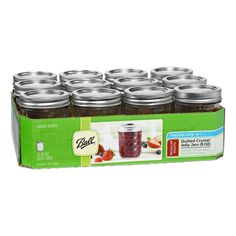 12 jars of jam in a box with labels on the front and bottom, each containing an individual's own label