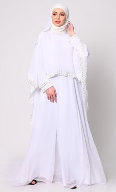 Step into the realm of elegance and sophistication with our stunning 3-piece ensemble, meticulously crafted to redefine your style with grace and beauty. The focal point of this ensemble is the Abaya, featuring a delicately embroidered border that adds a touch of regal charm to its classic silhouette. This Abaya,  Acco White Embroidered Dress With Cape Sleeves, Elegant Dabka Thobe For Eid, Elegant Abaya With Intricate Embroidery For Festive Occasions, Elegant Dabka Embellished Thobe With Traditional Drape, Elegant Festive Abaya With Intricate Embroidery, Traditional Draped Abaya With Intricate Embroidery For Wedding, Traditional Drape Abaya With Intricate Embroidery For Wedding, White Traditional Dress With Cape Sleeves, Elegant Embroidered Abaya For Traditional Ceremonies