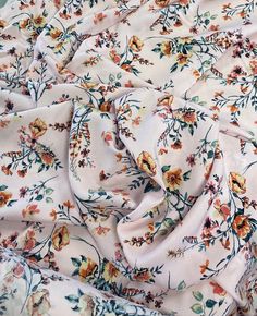 an image of a flowery fabric that is very soft and draping up