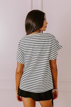 - Slay the day in stripes with this trendy top! - Unlined textured material with a striped pattern - A crew cut neckline - Short sleeves - A relaxed silhouette that ends in a straight hemline Chic Striped Crew Neck T-shirt, White V-neck Top With Contrast Stripes, Summer Striped Tops With Ribbed Neckline, White Tops With Striped Collar For Day Out, Striped Summer Tops With Ribbed Neckline, White Striped Collar Top For Day Out, White Top With Striped Collar For Day Out, Chic Short Sleeve Tops With Contrast Stripes, Chic Short Sleeve Tops With Striped Sleeves