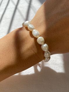 THE BAROQUE FRESHWATER PEARL BRACELET – Rimor Jewelry Beaded Bracelets With Baroque Pearl Drop, Everyday Baroque Pearl Bracelet With Pearl Charm, Formal Baroque Pearl Drop Bracelet, Handmade White Bracelets With Baroque Pearls, White Baroque Pearl Bracelets As Gift, Handmade White Baroque Pearl Bracelets, White Baroque Pearl Bracelets For Gifts, Pearl White Baroque Pearl Bracelet With Round Beads, White Baroque Pearl Bracelet For Gift