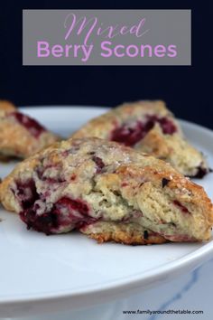 three berry scones on a white plate with text overlay that reads, mixed berry scones