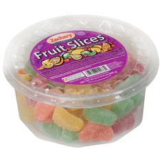 a plastic container filled with gummy fruit slices