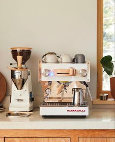 an espresso machine sitting on top of a counter