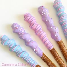 there are five different types of donuts in the shape of candy canes with sprinkles on them