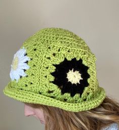 This handmade granny square crochet bucket hat is the perfect accessory to add a pop of color and style to any outfit. Made with care and attention to detail, each hat is crafted with a unique combination of colorful granny squares, creating a one-of-a-kind look. Whether you're running errands, lounging by the pool, or attending a music festival, this versatile hat is the perfect addition to your wardrobe. Care Instructions: Machine washable in cold water. Gentle cycle recommended. Lay flat to d Handmade Yarn Bucket Hat For Spring, Handmade Yarn Crochet Hat For Spring, Casual Crochet Hat With Granny Square, Handmade Trendy Crochet Hat For Spring, Handmade Crochet Bucket Hat For Spring, Trendy Handmade Crochet Hat For Spring, Handmade Crochet Hat For Spring, One Size, Spring Crochet Hat One Size, Retro Crochet Hat For Spring, One Size