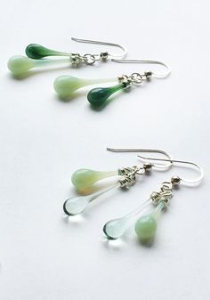 Get ready to wear these earrings everyday - that’s how much you’ll love them! More than minimal, less than dramatic, these are everyday earrings you’ll be comfortable wearing to any event. A charming pairing of complementary colored green drops of sun-melted glass, these earrings are extraordinarily versatile. Earring length: 1 1/4" - 2 1/4" (3.2 cm - 5.7 cm) Eco-friendly jewelry, made from a broken antique jadeite plate and Coca-Cola bottle melted with focused sunshine Recycled sterling silver Cola Bottle, Golden Honey, Earrings Everyday, Coca Cola Bottle, Eco Friendly Jewelry, Argentium Silver, Recycled Bottles, White Jewelry, Recycled Silver