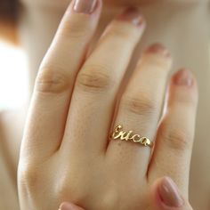 "14K Solid Gold Name Ring-Dainty Name Ring- Custom Stacking Name Ring - Birthday Gift- Bridesmaid-Gift For Mom-Gift For Her 14K Solid Gold Name ring will be handmade with your desired, Here is a dainty, delicate and simple, yet classy minimalist Name Ring . This is 14k Solid Yellow Gold. (this necklace is 100% real. It's not plated ) Perfect for everyday use. A beautiful customized gift for yourself or someone you care for. \"What's in a name?\" Spell out a name and let us create a beautiful gif Named Wedding Rings, Gold Ring Name Design, Customizable Yellow Gold Engraved Ring For Wedding, Customizable Yellow Gold Engraved Wedding Ring, Gold Engraved Name Ring For Wedding, Customizable Yellow Gold Initial Ring For Wedding, Elegant Customizable Stackable Rings For Wedding, Dainty Personalized Ring For Birthday, Personalized Dainty Rings For Birthday