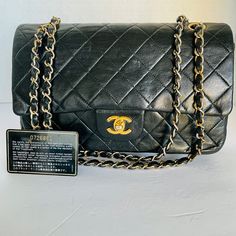 Iconic Chanel Black Lambskin Double Flap Bag Is A Staple That Keeps Forever. Features Gold Hardware With Cc Turn Lock Clasp Closure. Classic Chain Interwoven With Leather. Verified Authentic By Poshmark Team. Bag Has Been Professionally Dyed For A Refresh Look. Please See Picture Of The Two Smaller Interior Pockets. Shows The Wear From Stickiness. Doesn’t Take Away From The Main Compartment Of This Bag. Other Than The Wear In Those Two Smaller Pockets It Is In Great Shape. Stored For Years. Meas Vintage Color, Chanel Bags, Chanel Black, Bag Vintage, Flap Bag, Chanel Classic, Gold Hardware, The Two, Limited Time