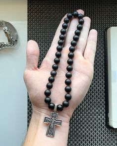 "Christian Orthodox 33 Prayer Beads With Steel Cross Jesus Crucifix Matte Black Onyx 33 Beads Rosary Silver Plated Cross Pendant * PRODUCT DETAILS Bead - 33 pcs Bead Size - 10 mm / 0.39\" Materials: Matte Black Onyx Silver Plated Cross Strong Stretch Cord 100% HANDMADE! SHIPPING IS AVAILABLE FOR USA AND CANADA ONLY! For other countries temporarily unavailable. USA - 2 - 3 weeks Canada - 3 - 4 weeks We usually ship orders the next business day after your payment is received. Product will be sent inside a drawstring pouch. * MORE IN MARKOVSTONE: https://www.etsy.com/shop/MARKOVSTONE * FEEDBACKS If you are happy with the purchases here, 5 stars positive feedback will be appreciated. If you will have any question or problem regarding the transaction. Please do not leave us neutral or negative Black Spiritual Necklaces With Large Beads, Spiritual Black Necklace With Large Beads, Spiritual Black Necklaces With Large Beads, Black Gemstone Beads For Jewelry Making, Black Cross Jewelry With 8mm Beads, Black Spiritual Beaded Necklaces With Polished Beads, Large Black Beads For Gifts, Onyx Beaded Necklaces With Black Round Beads, Onyx Beaded Necklaces With Round Black Beads