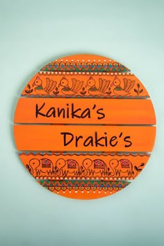 an orange sign that says kankka's drakies on it with elephants