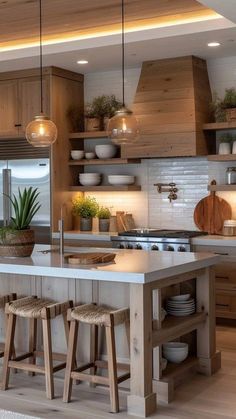 a kitchen with wooden cabinets and white counter tops, two stools at the island